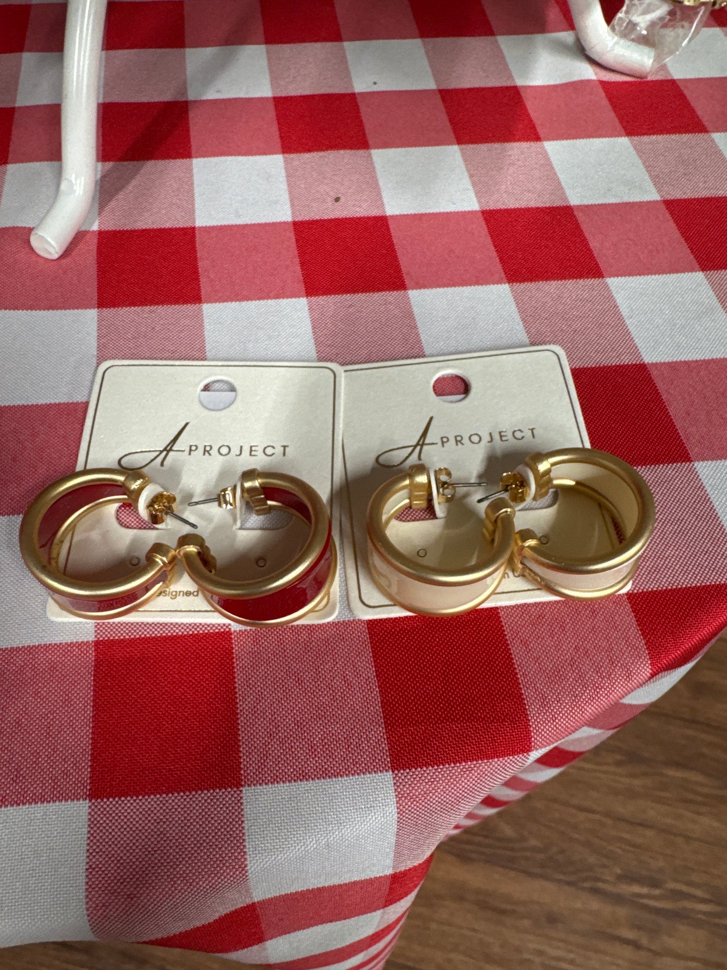 red/white hoop earrings